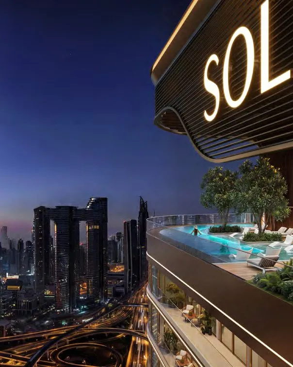 Lit SOL crown and terrace pool at night, Burj Khalifa beyond